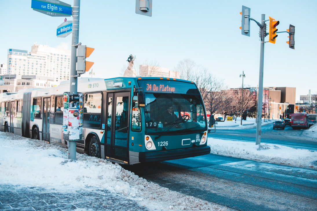 Blue and White Bus on Road